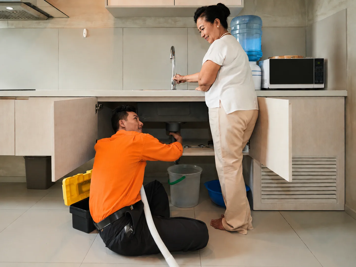 Wingate plumber clearing a clogged sink drain